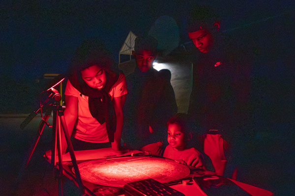 What red lights reveal in the dark fascinates a family